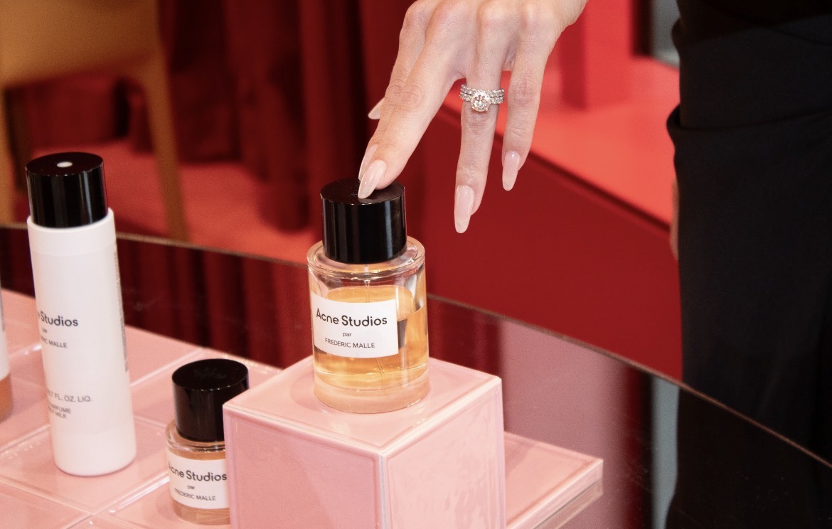 Fragrance bottle on a pink plinth